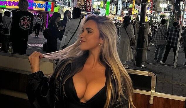 The ‘World’s Hotest Volleyball Player’ shows off her ample assets in a plunging top while sight-seeing in Tokyo