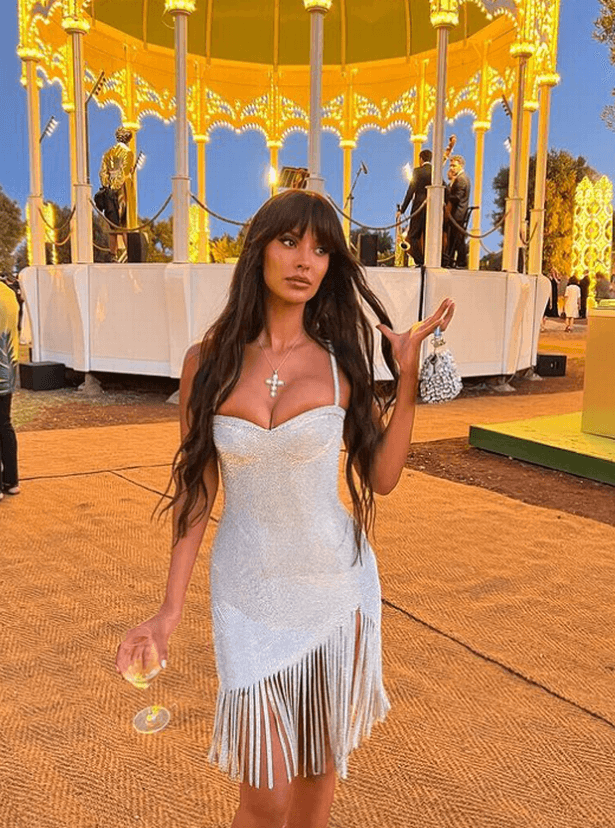 Lovers of Maya Jama beg the host to provide a warning as she shows off her plunging dress on Love Island