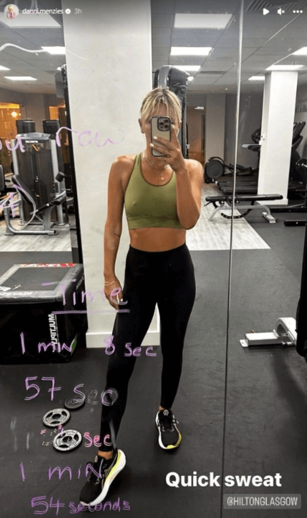 After sweating it out at the gym, Danni Menzies posed for an astonishing mirror selfie wearing a braless tank top.