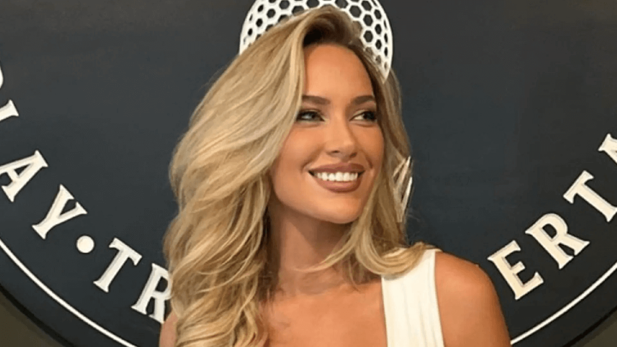 A low-cut white top nearly reveals Paige Spiranac's stunning figure