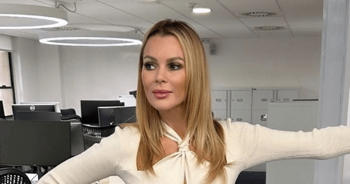 In an eye-catching combination, Amanda Holden ditches her bra for gorgeous top and gray miniskirt