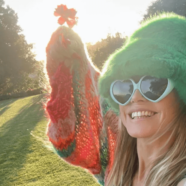 Among the recent carousel posts the German supermodel shared on Instagram, she showed her gleefully walking through a park with a flower in her hand.