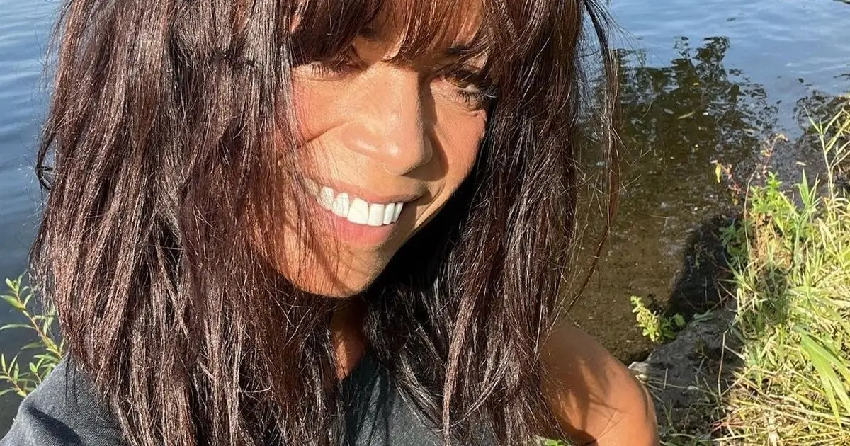 While plunging in cold water, Jenny Powell wears a skimpy swimsuit to show off her gorgeous figure