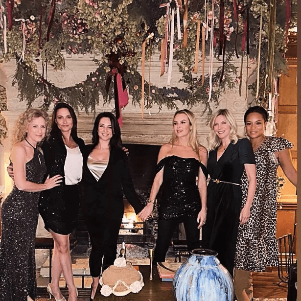 In a figure-hugging dress that accentuated her silhouette, the Britain's Got Talent judge enjoyed a festive getaway with close friends she's known for 25 years, minus Chris Hughes.