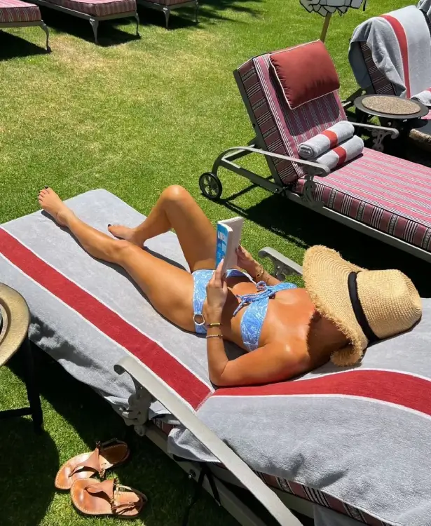 Amanda Holden demonstrates her toned physique in a sizzling blue bikini