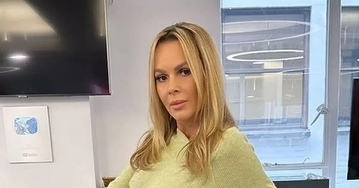 Amanda Holden, 53, goes braless in a skinny cut-out dress and admits ‘it’s chilly’ as she strutted around the studios