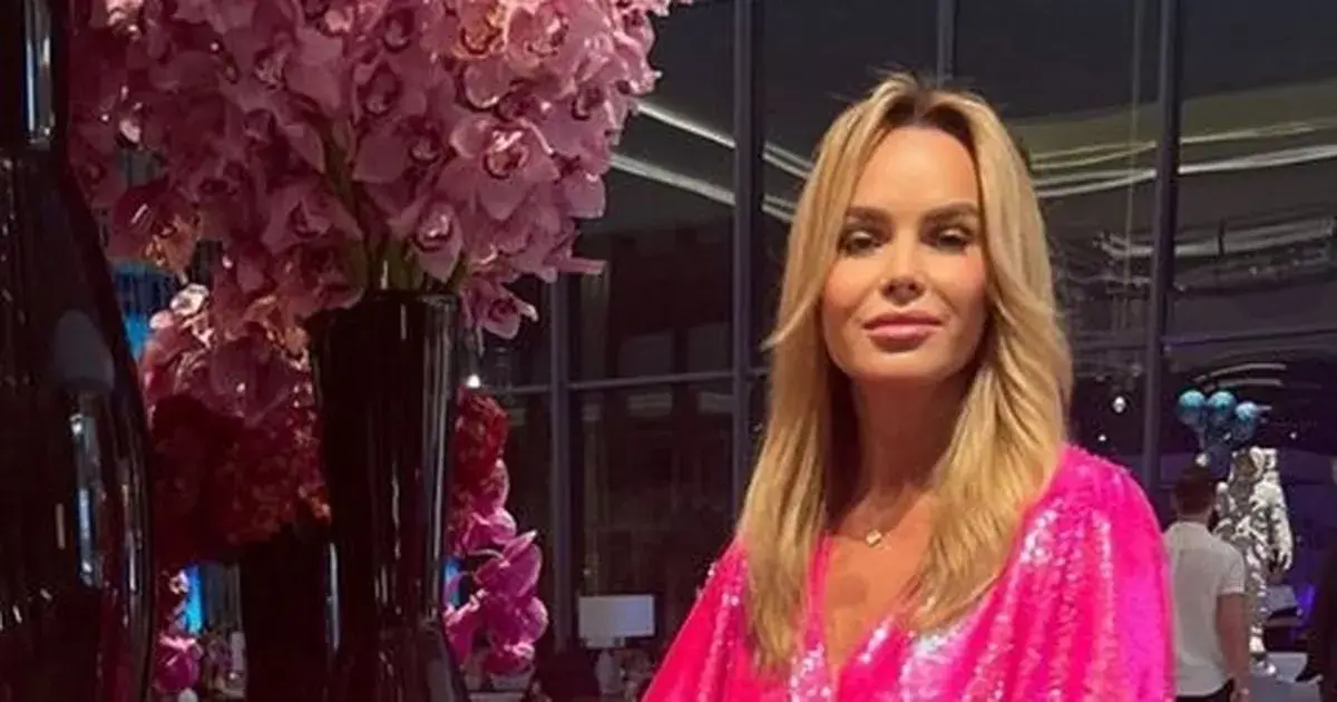 Amanda Holden showing off her killer curves as she puts on leggy display in a neon pink minidress