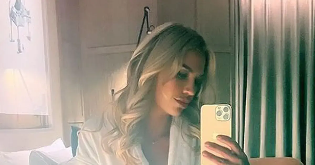 Christine McGuinness showed off her sensational body in a white sheer robe as she posed for a cheeky selfie