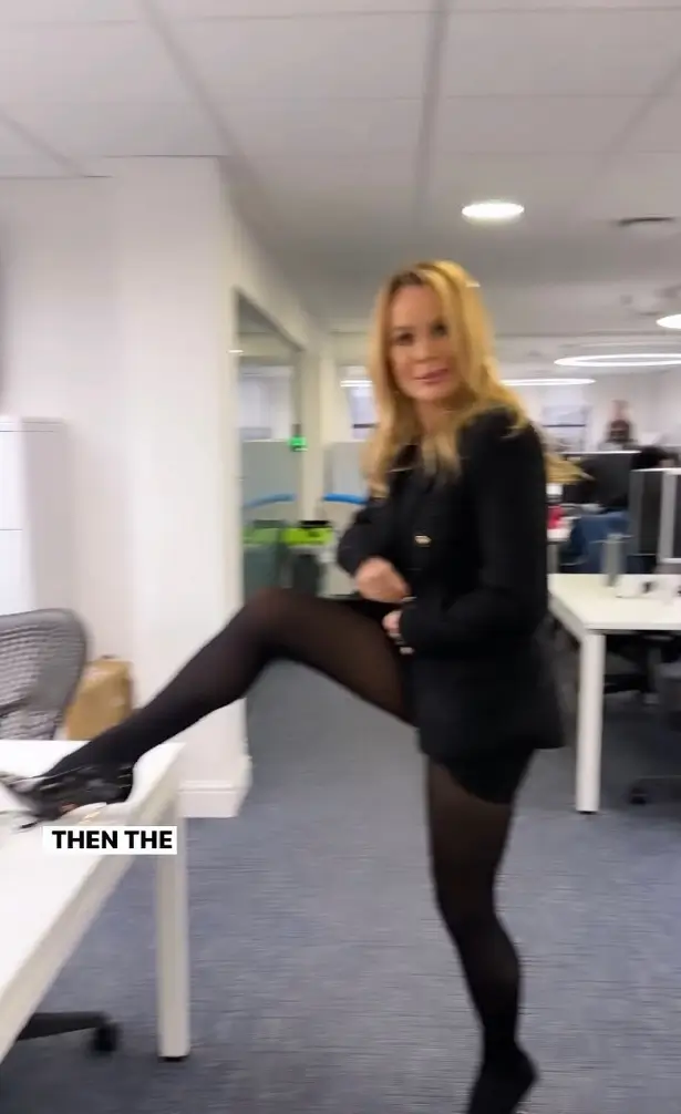 While wearing a miniscule skirt and heels, Amanda Holden strutted through the Heart FM office showcasing her outfit before raising her leg in an eye-catching display.