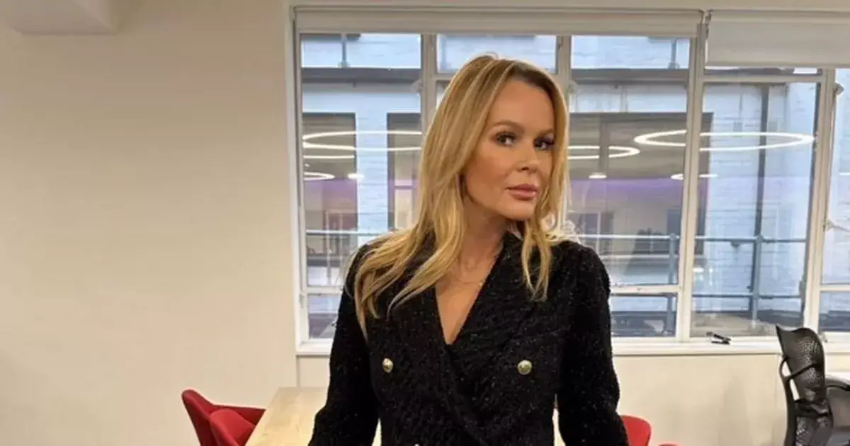 In a miniscule skirt and heels, Amanda Holden raising her leg in an eye-catching display