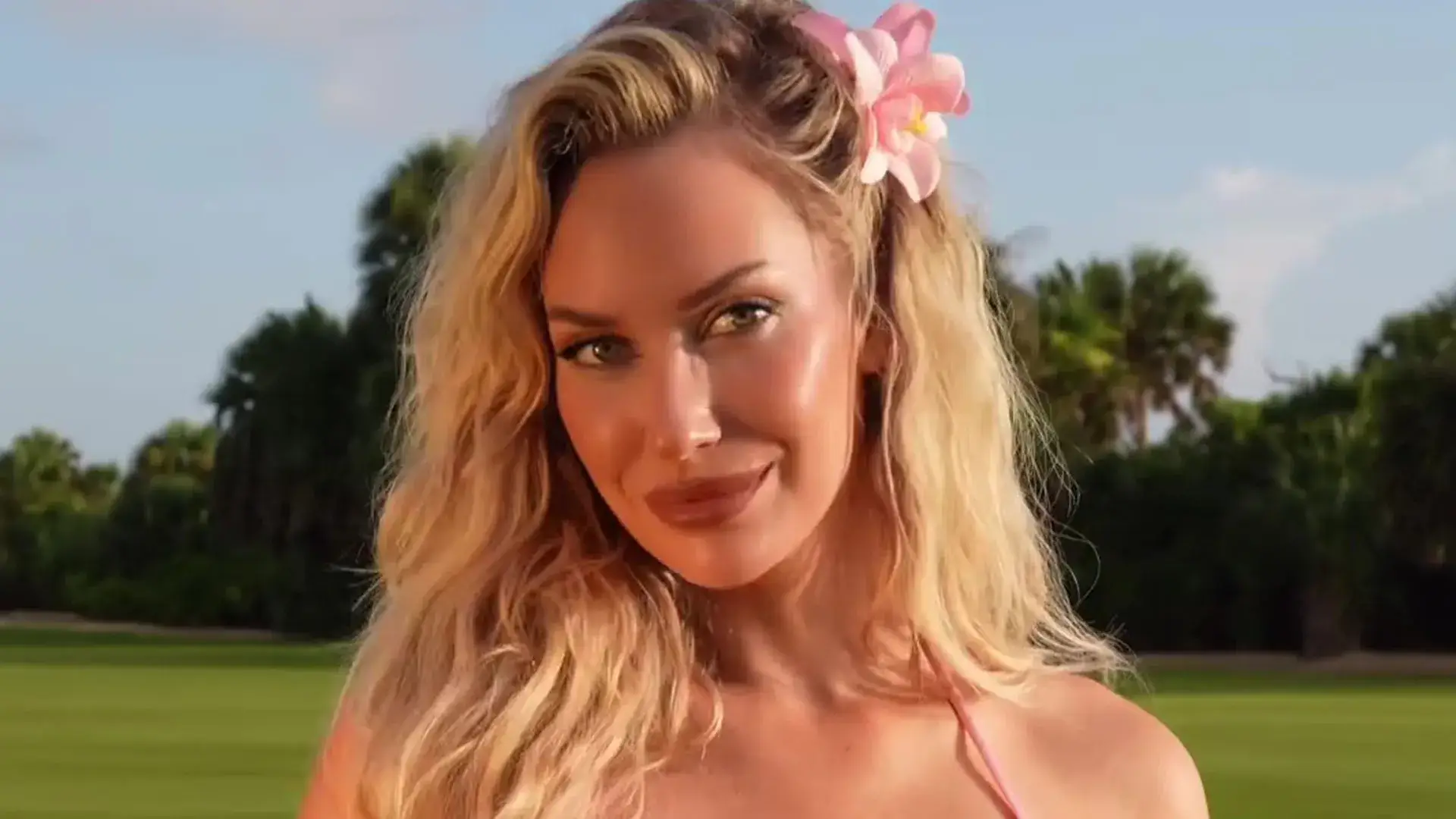 Paige Spiranac goes braless in a tight-fitted golf outfit as she puts a ball on the tee