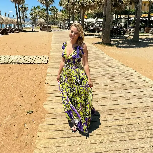 Last week, Laura Hamilton wore a purple and yellow mini dress for a photo basking in the sun by the beach.