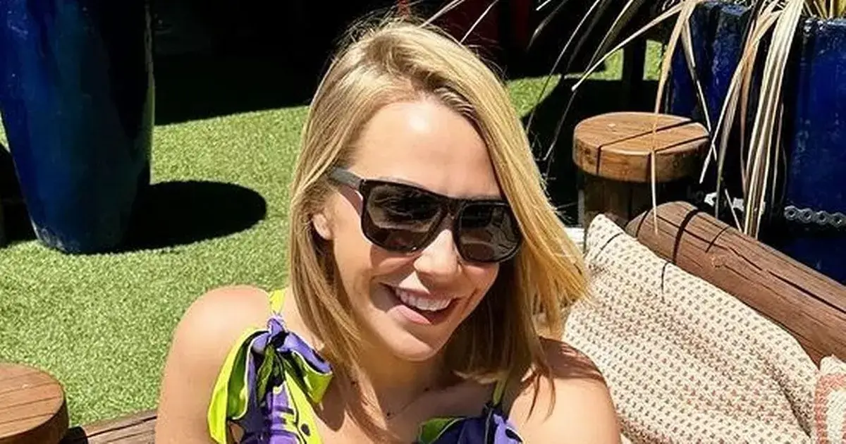 Laura Hamilton, 42, wows in low-cut dress on the beach as fans hail her ‘so hot’