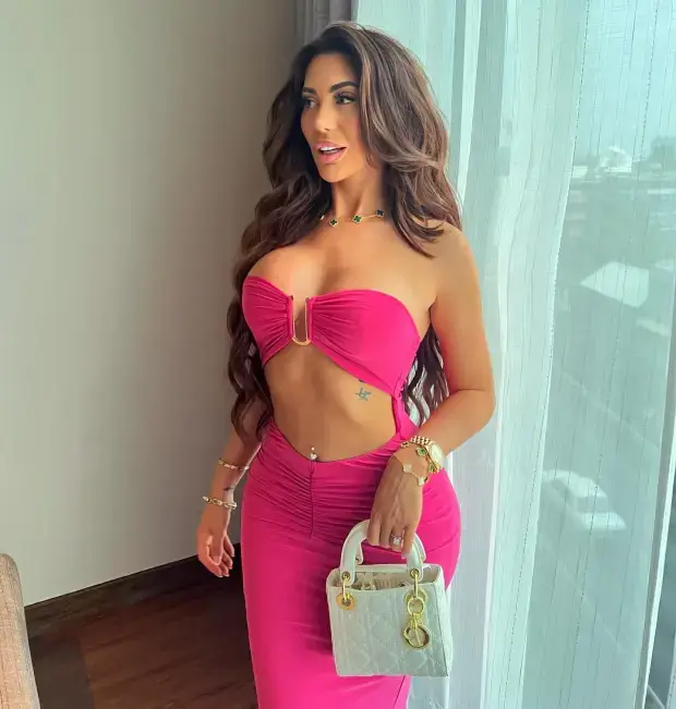 Despite the risk of a wardrobe malfunction, Chloe Ferry chose a hot pink skintight dress to wear for the cast getaway to Thailand.