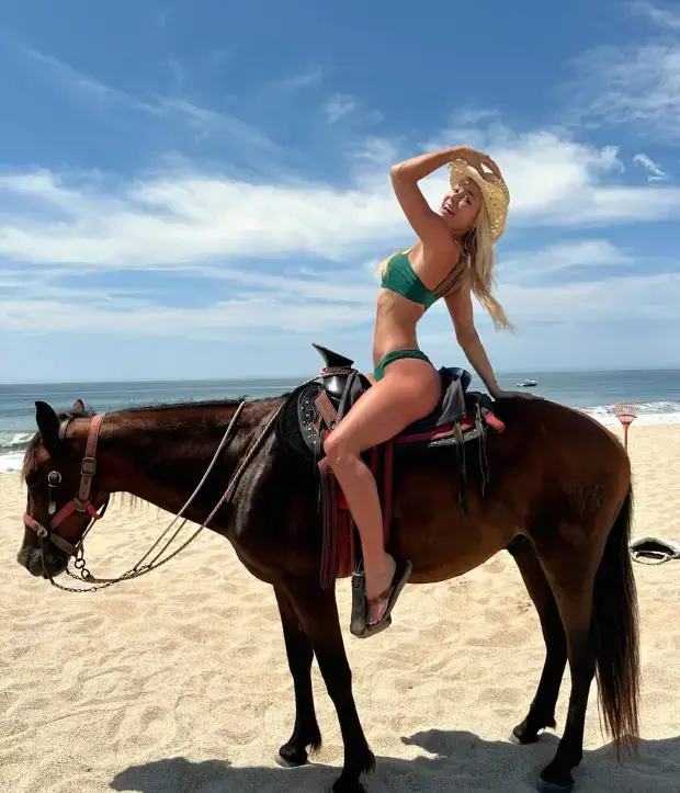 The day before, Louisiana gymnast Olivia Dunne looked beautiful in a green swimsuit and wicker hat.