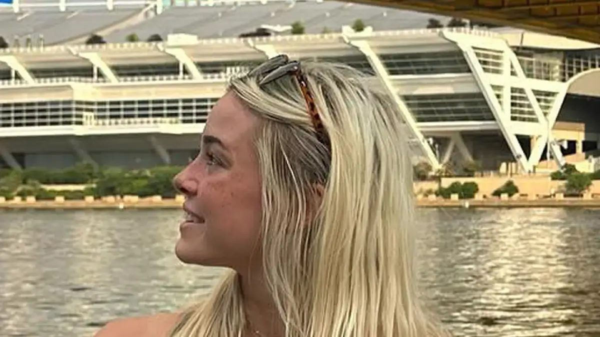 Olivia Dunne joins boyfriend Paul Skenes for loved-up boat cruise in a tiny green bikini as followers label him ‘so luck’