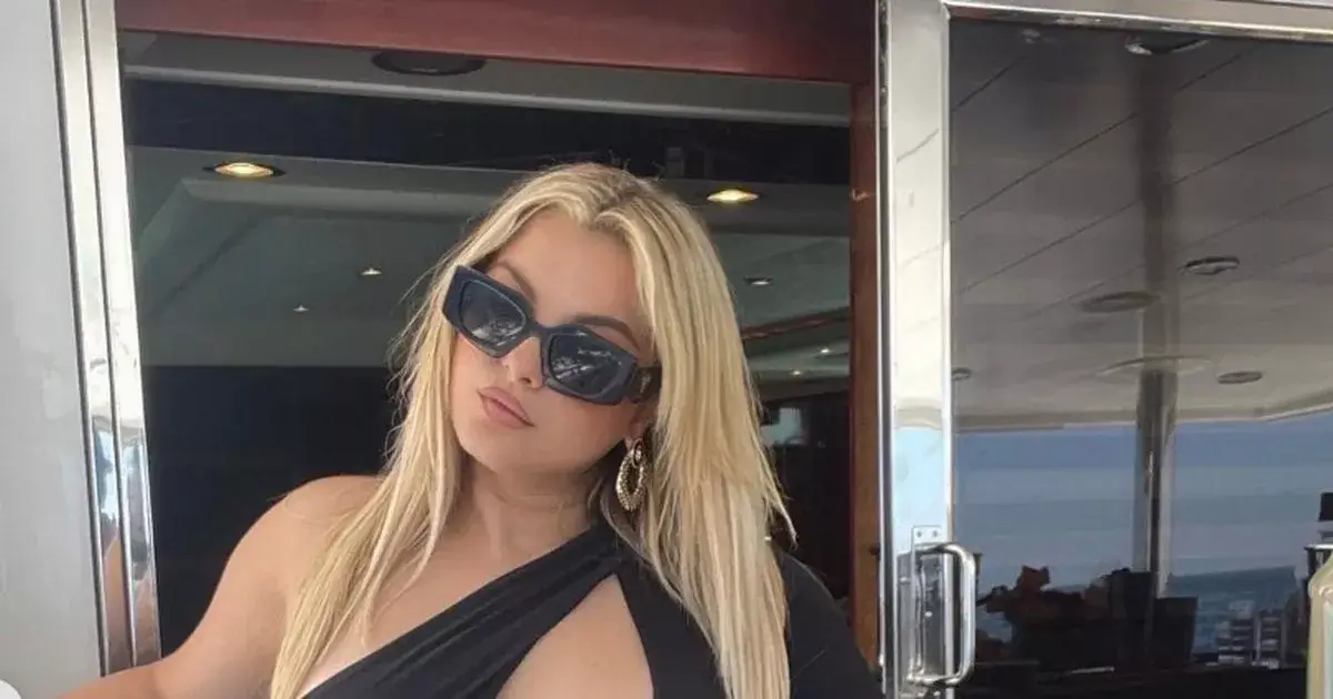 In a black monokini, Bebe Rexha sunbathed topless while displaying her curves during a luxurious getaway to Mykonos