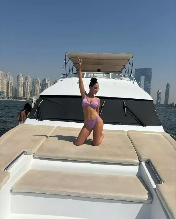 In a sizzling snap taken in Dubai, N-Dubz star Tulisa Contostavlos made fans swoon in a tiny purple bikini.