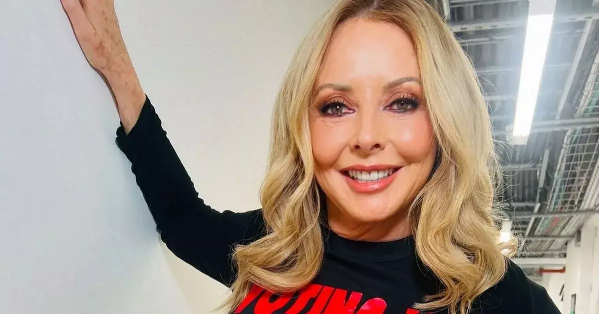 Carol Vorderman pours killer curves into a pair of skintight leather pants as she struts into BBC studios