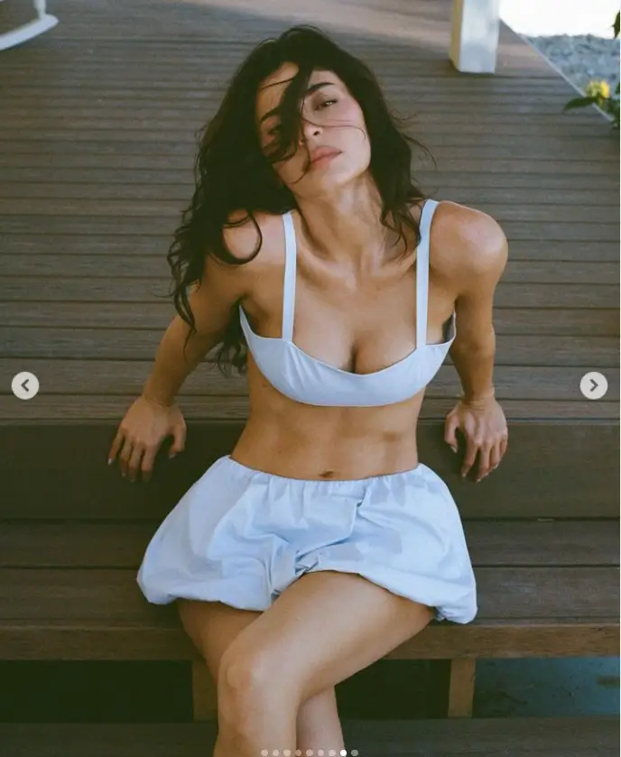 Kylie Jenner showed off her bust in a white bra top as part of her 'poplin' summer collection