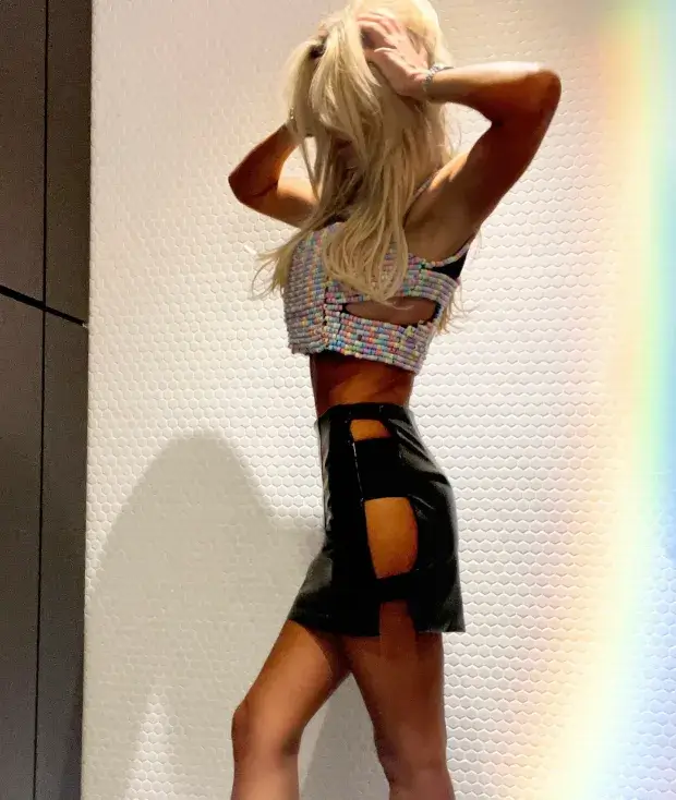 In an Instagram post, Christine McGuinness displayed her stunning figure in a daring PVC skirt and edible crop top for Pride.