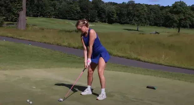 Putting a quick putt on the green, Paige Spiranac put on an impressive display as she entered the green in a short blue dress.