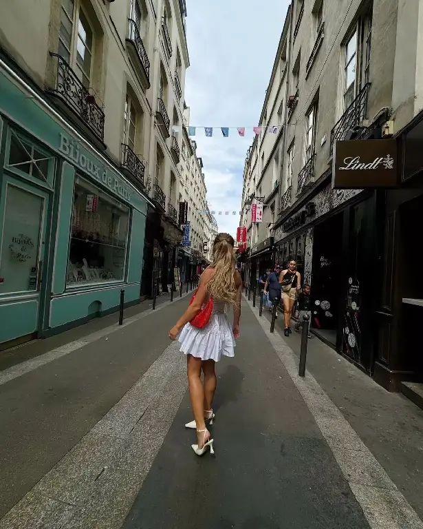 As part of the trip, Sydney posed with a vibrant white dress and white heels while strolling down Paris' iconic streets, radiating light and colour.