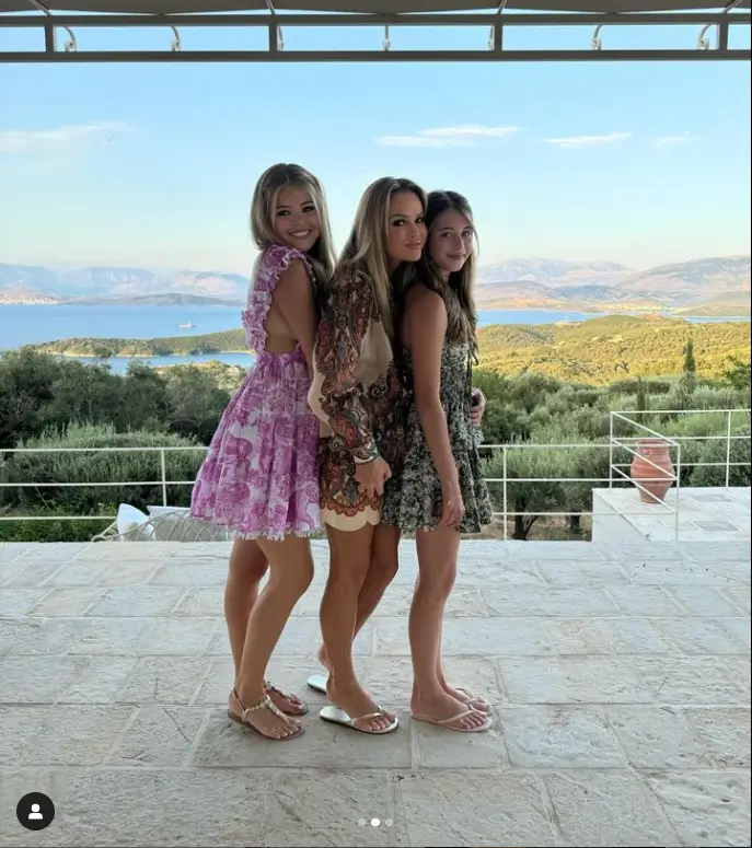 Amanda Holden looked beautiful in bright patterned dresses while unwinding in Greece with lookalike daughters Lexi and Hollie