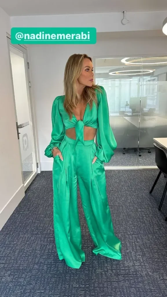 Amanda Holden was stunning in a green plunging two-piece that exposed her killer cleavage in the Heart FM studios