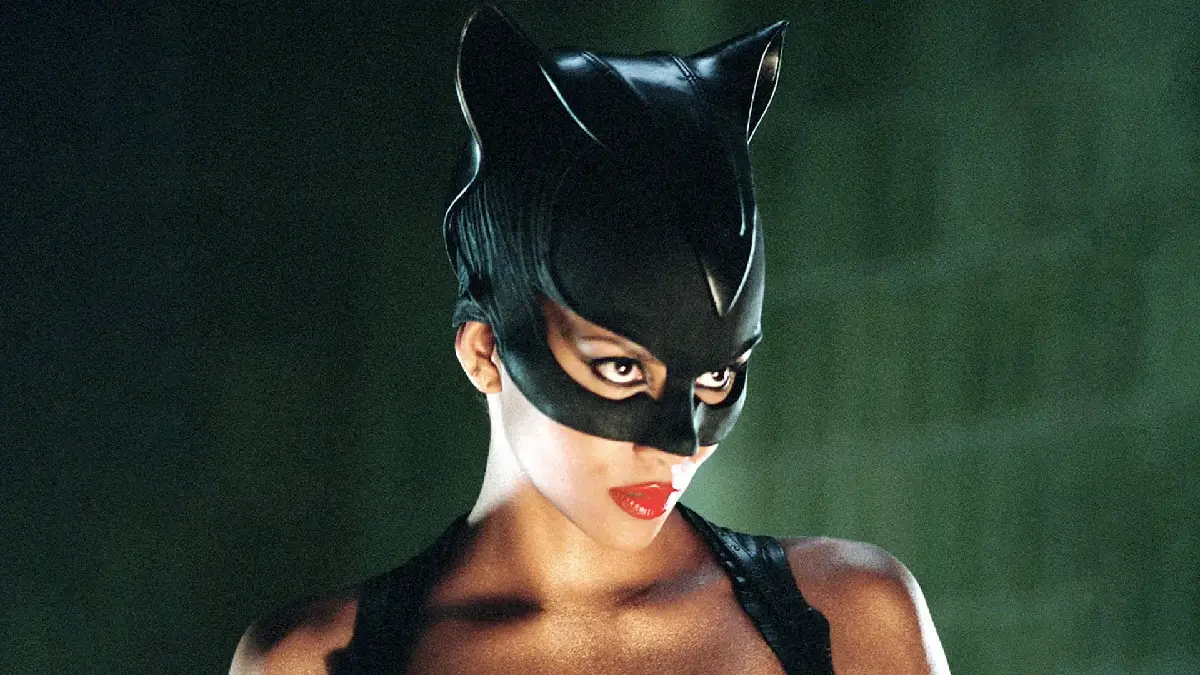 During a topless photo shoot, Halle Berry covered herself with two adorable black rescue cats