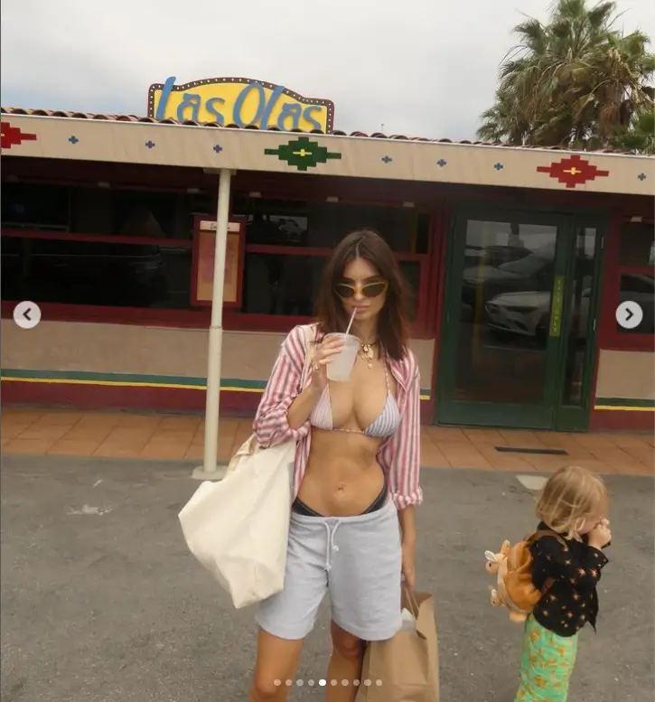 When Emily Ratajkowski visited her hometown with her son, Sylvester, she showed off her incredible bikini body in a tiny grey and white striped two-piece.