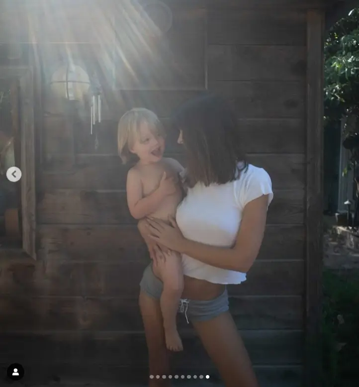 Emily Ratajkowski sported a tiny grey and white striped two-piece while displaying her incredible bikini body as she took her son to visit her hometown