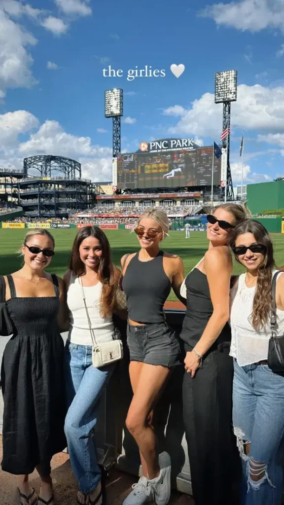 Dunne shared the photo on Instagram stories, along with one of them clinking champagne glasses; clad in black vests and denim shorts with shades, she looked stylish.