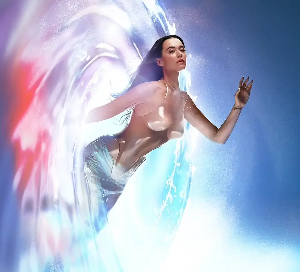 Katy Perry appears topless in a see-through iridescent skirt as she announces title and release date of her new album