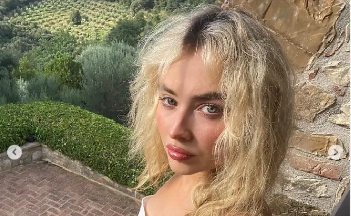 Sabrina Carpenter looks stunning in a red one-piece swimsuit while on vacation in the Italian countryside