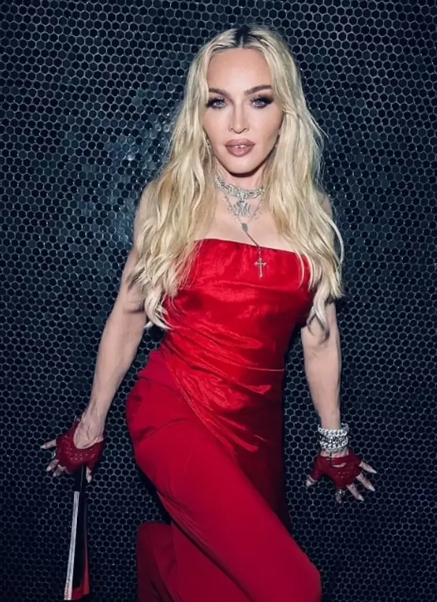 On July 4, Madonna shared an amorous moment with a handsome younger man as she reflected on a year ago's near-death experience.