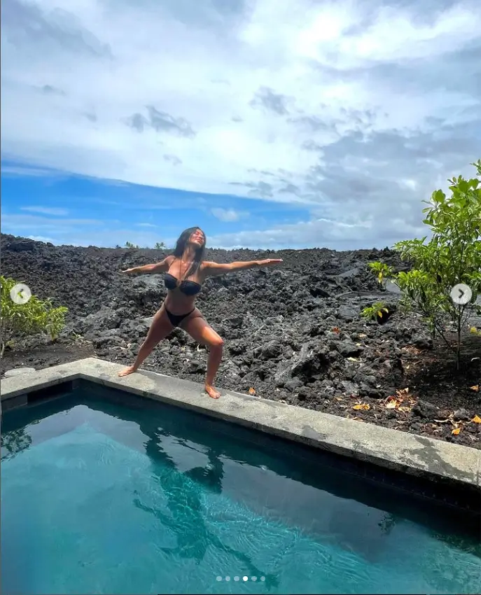 She also captured a mid-air pic while dashing around the outdoor pool as she closed her gallery with a black-and-white picture.