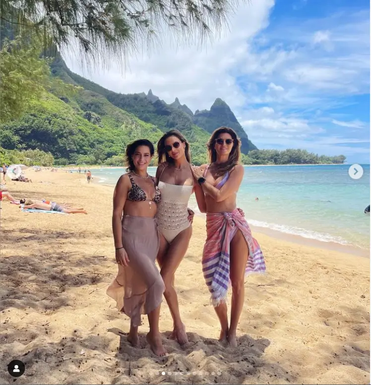 She showed off the stunning detailing on her backless swimsuit as she posed with her friends on the beach. The trio ripped off their sarongs and posed knee-deep in the ocean once more.