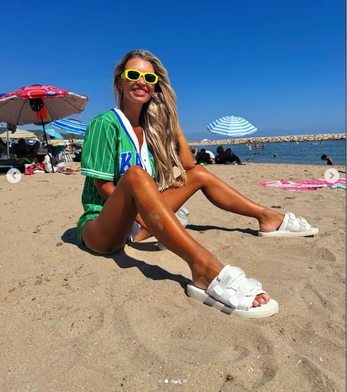 A steamy Instagram post by Christine McGuinness on Tuesday where she shared a slew of beach snaps set pulses racing as she went braless in an open baseball jersey.