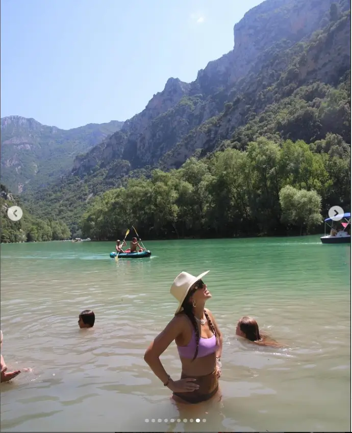 Taking a dip at a picturesque beach before enjoying an ice cream while shopping, the stunning actress was spotted wearing a stylish purple bikini top while dancing during a boat ride.