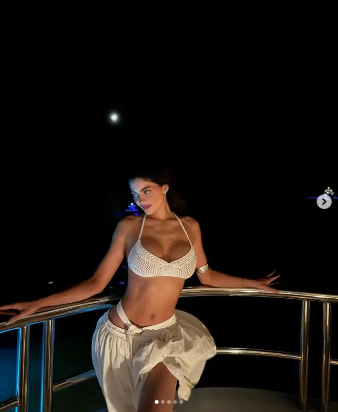 On last Thursday, Kylie Jenner revealed her summer body as she posed on a yacht during a lightning storm in Venroy's $100 white crochet halter bralette.