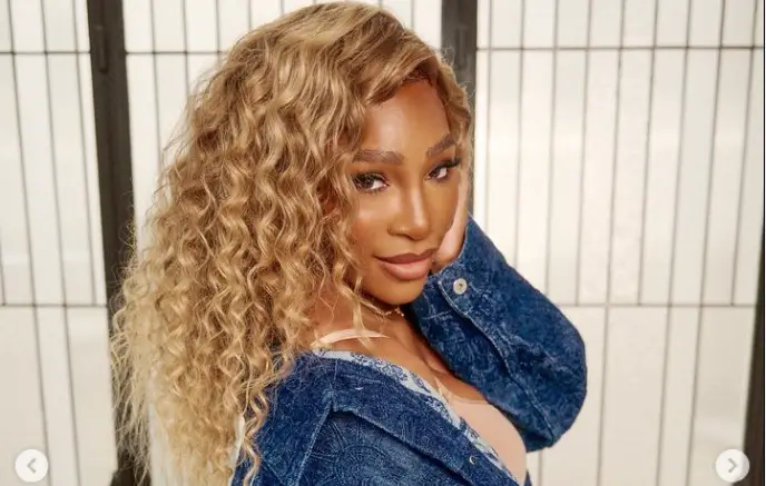 Serena Williams poses in a denim jacket and matching jeans as she declares she is ‘100 percent real’ from forehead to toe