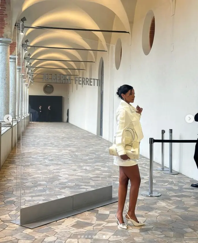 An oversized white shirt dress by Maya Jama captured the attention of onlookers as she stepped out in Italy's capital for the Spring/Summer 2025 fashion show