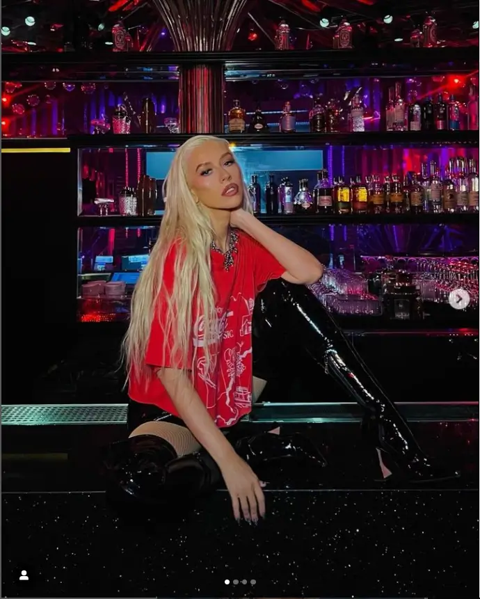 In anticipation of Friday's final residency show, Christina Aguilera took to Instagram to share photos of herself posing suggestively on a bar counter.