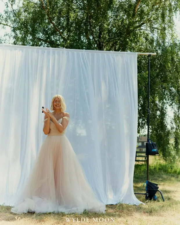 Holly Willoughby looked incredible in a stunning white gown as she promoted her latest fragrance