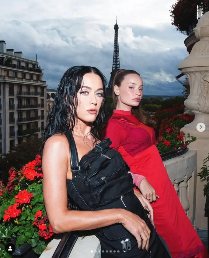 In a black midi dress and leather knee-high boots, Katy Perry looked striking as she arrived the PFW Balenciaga show