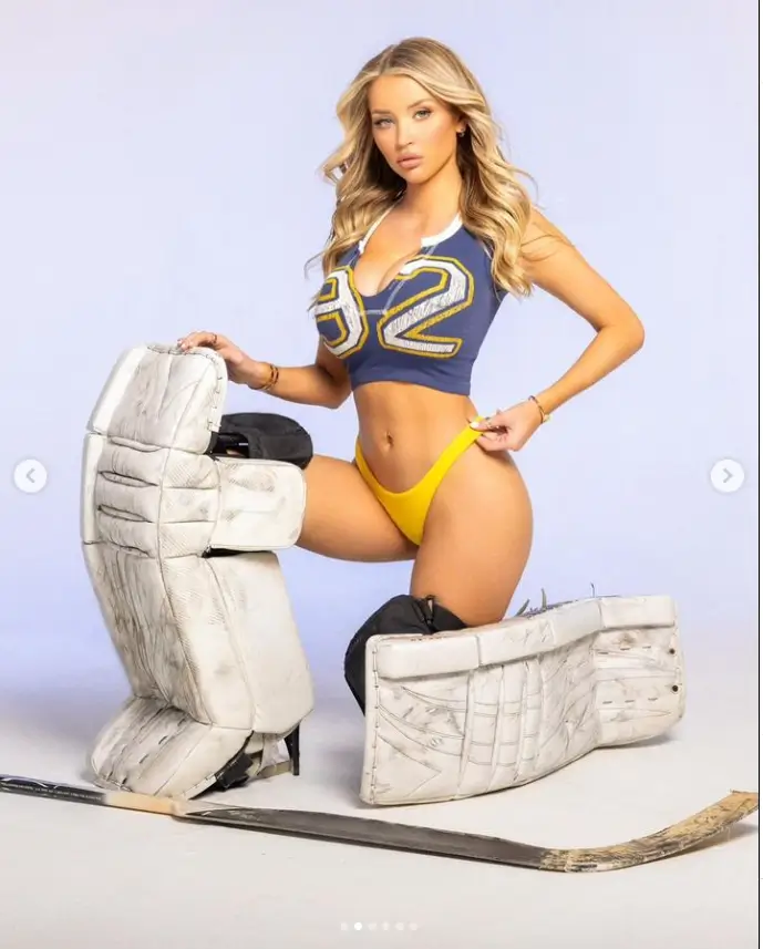 A few photos of Mikayla showed her posing in a crop top and yellow bikini bottoms, but she concealed her legs behind her goalie pads and a hockey stick.