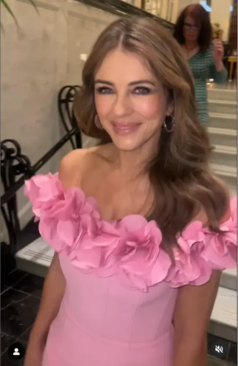 In an off-the-shoulder midi dress in bright pink, Elizabeth Hurley looked sensational