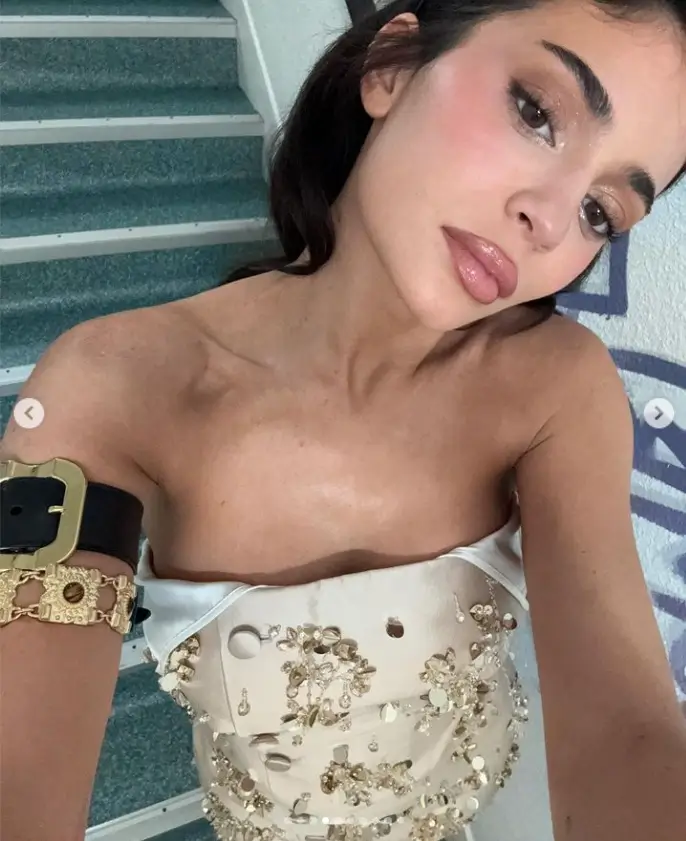 Kylie Jenner flashs her toned pins in an embellished strapless minidress champagne number