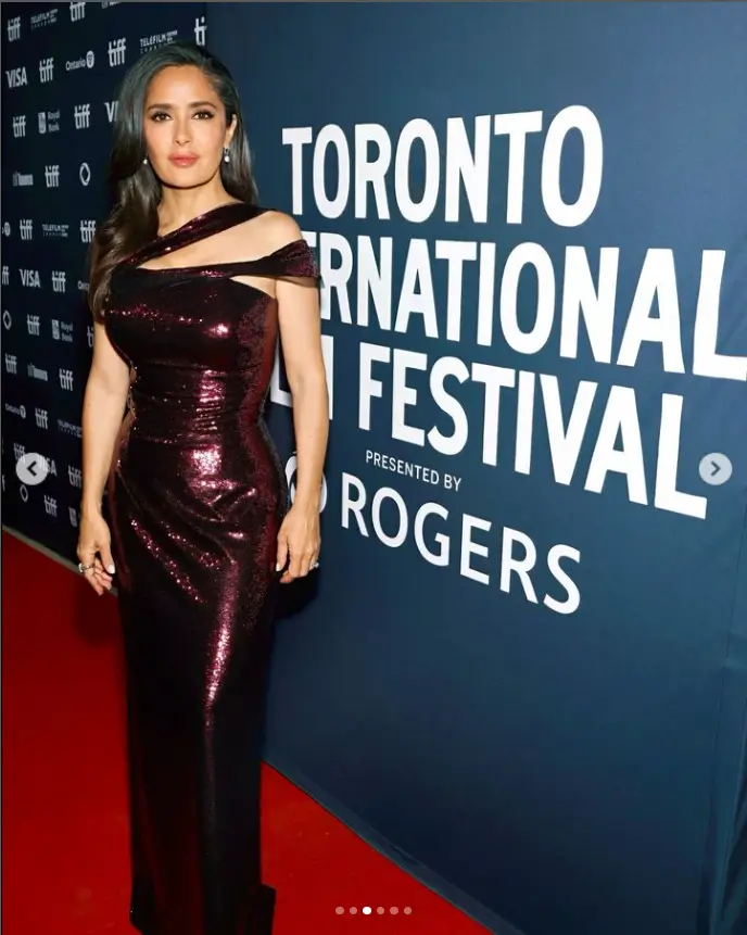 A few days ago, Salma stepped out on the red carpet ahead of the film's premiere in a burgundy sequin dress that hugged her feminine curves on top and relaxed at the waist.